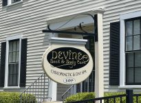 Devine Back & Body Care signage